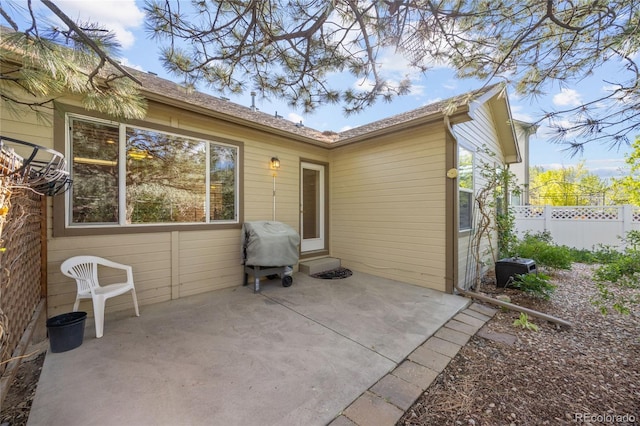 2226 Lily Dr, Loveland, CO 80537 - back of house featuring a patio and fence