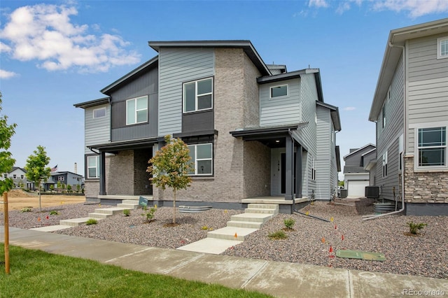 1418 Hudson Pl, Longmont, CO 80501 - modern home with brick siding