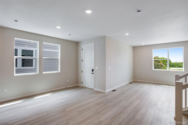 1418 Hudson Pl, Longmont, CO 80501 - unfurnished room featuring light wood-type flooring, recessed lighting, and a pendent fire sprinkler