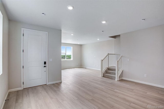 1418 Hudson Pl, Longmont, CO 80501 - unfurnished room featuring stairway, light wood-type flooring, and recessed lighting