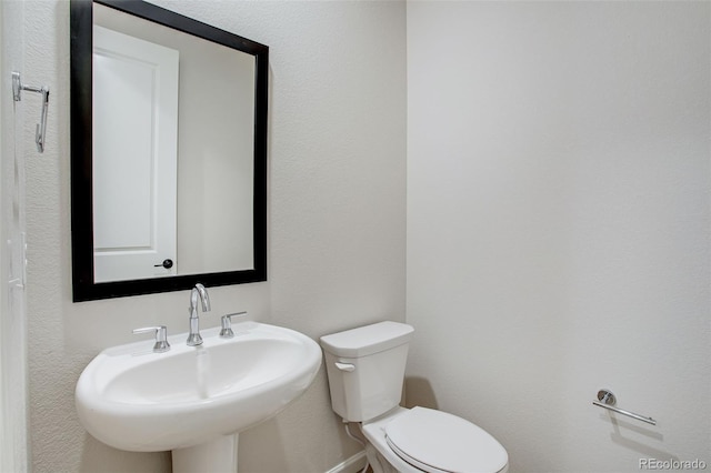 1418 Hudson Pl, Longmont, CO 80501 - half bathroom with a sink and toilet