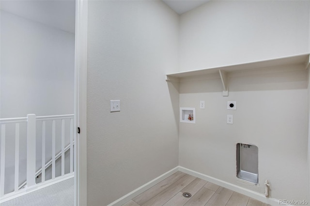 1418 Hudson Pl, Longmont, CO 80501 - washroom with hookup for a washing machine, light wood-style flooring, electric dryer hookup, and hookup for a gas dryer