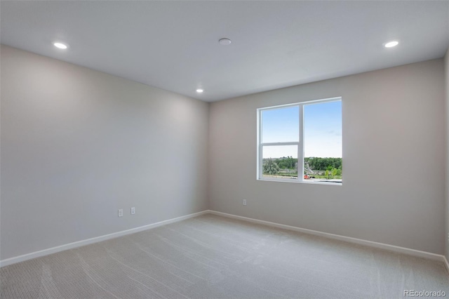 1418 Hudson Pl, Longmont, CO 80501 - empty room featuring light colored carpet and recessed lighting