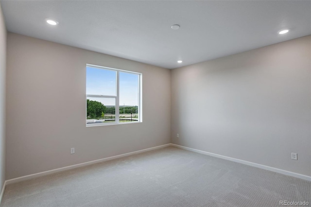 1418 Hudson Pl, Longmont, CO 80501 - empty room with light carpet and recessed lighting