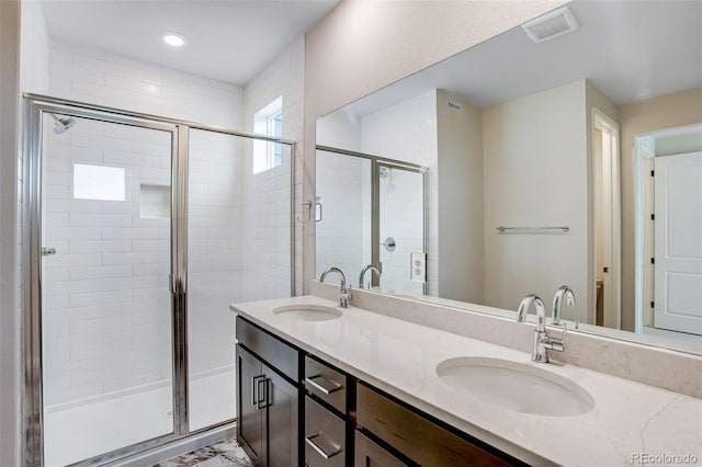1418 Hudson Pl, Longmont, CO 80501 - bathroom with a stall shower, double vanity, and recessed lighting
