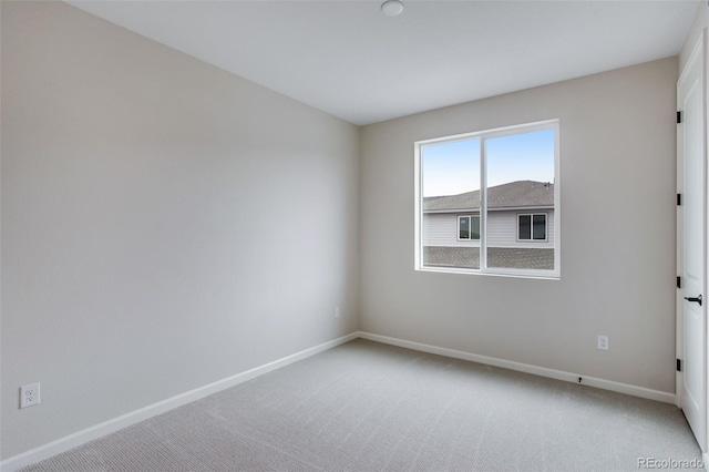 1418 Hudson Pl, Longmont, CO 80501 - spare room featuring light colored carpet