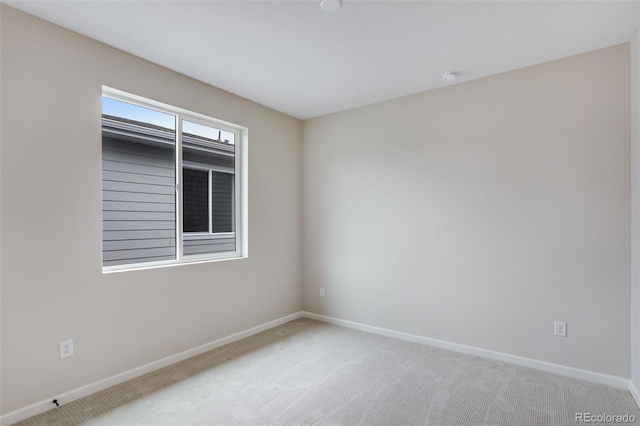 1418 Hudson Pl, Longmont, CO 80501 - spare room featuring light carpet and a smoke detector