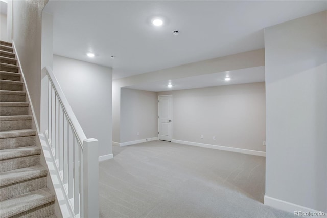 1418 Hudson Pl, Longmont, CO 80501 - finished below grade area with recessed lighting, light colored carpet, and stairway