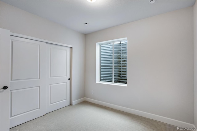1418 Hudson Pl, Longmont, CO 80501 - unfurnished bedroom with light carpet and a closet