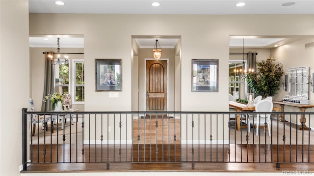 6303 Ellingwood Point Pl, Castle Rock, CO 80108 - foyer with a chandelier, recessed lighting, and ornamental molding