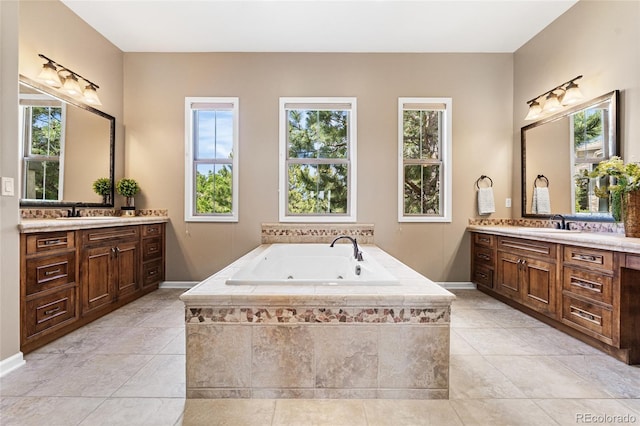 6303 Ellingwood Point Pl, Castle Rock, CO 80108 - bathroom featuring two vanities, plenty of natural light, and a whirlpool tub