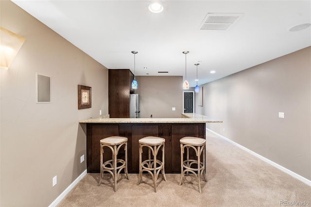 6303 Ellingwood Point Pl, Castle Rock, CO 80108 - indoor bar with freestanding refrigerator, light carpet, hanging light fixtures, and recessed lighting