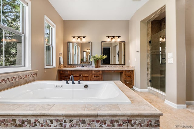 6303 Ellingwood Point Pl, Castle Rock, CO 80108 - bathroom with a garden tub, vanity, a shower stall, and tile patterned flooring
