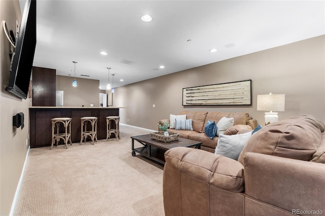 6303 Ellingwood Point Pl, Castle Rock, CO 80108 - living area featuring light carpet, recessed lighting, and bar