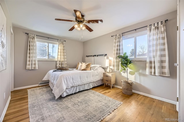 bedroom featuring hardwood / wood-style floors and ceiling fan