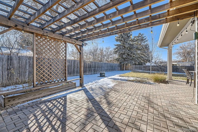 snow covered patio with a pergola