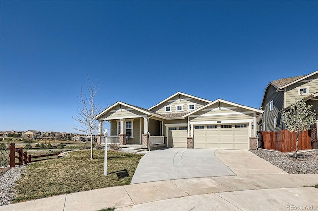 14521 Vancouver Pl, Parker, CO 80134 - craftsman inspired home featuring covered porch, a garage, fence, concrete driveway, and brick siding