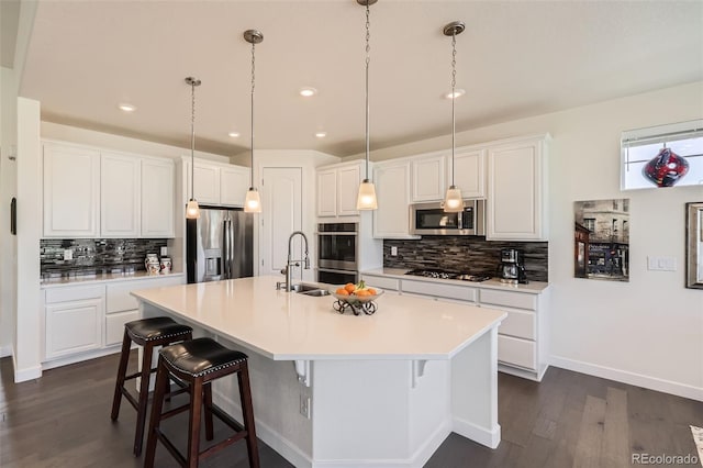 14521 Vancouver Pl, Parker, CO 80134 - kitchen featuring tasteful backsplash, appliances with stainless steel finishes, dark wood-style flooring, and a sink