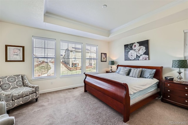 14521 Vancouver Pl, Parker, CO 80134 - bedroom featuring crown molding, a tray ceiling, baseboards, and carpet