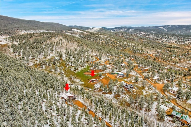 snowy aerial view featuring a mountain view