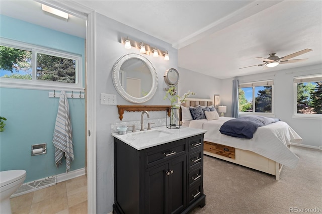6621 E Peakview Pl, Centennial, CO 80111 - ensuite bathroom with vanity, baseboards, toilet, and a ceiling fan