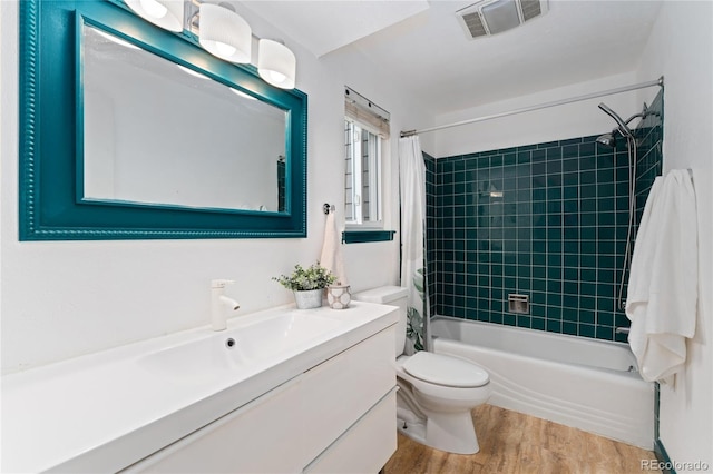 6621 E Peakview Pl, Centennial, CO 80111 - full bathroom featuring vanity, wood finished floors, shower / bath combo, and toilet