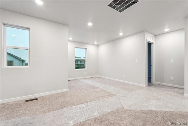 19019 E 94th Pl, Commerce City, CO 80022 - empty room featuring light carpet, recessed lighting, and baseboards