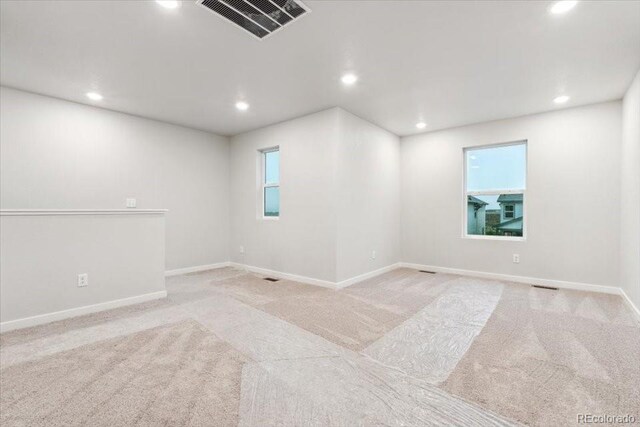 19019 E 94th Pl, Commerce City, CO 80022 - spare room with light colored carpet, recessed lighting, and baseboards