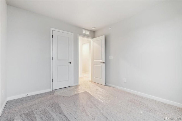 19019 E 94th Pl, Commerce City, CO 80022 - unfurnished bedroom featuring carpet and baseboards