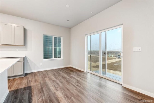 19019 E 94th Pl, Commerce City, CO 80022 - unfurnished dining area featuring wood finished floors and baseboards