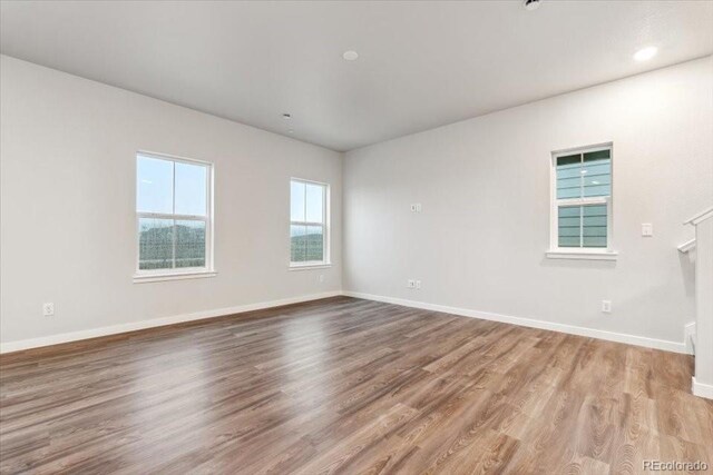 19019 E 94th Pl, Commerce City, CO 80022 - empty room with baseboards and wood finished floors