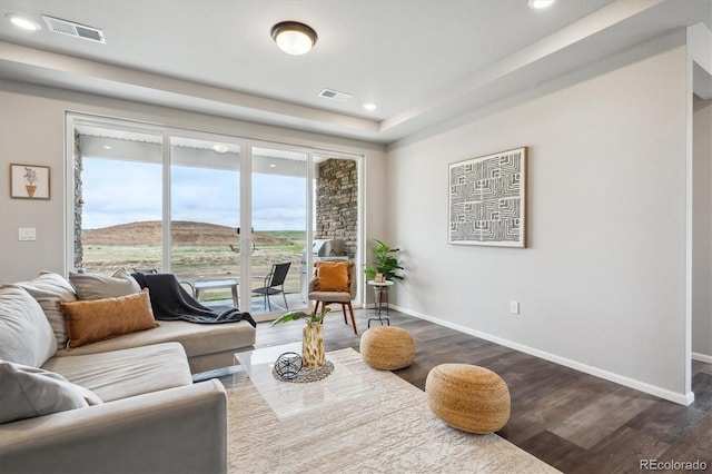 5142 N Quemoy Ct, Aurora, CO 80019 - living room with dark wood finished floors, baseboards, and recessed lighting