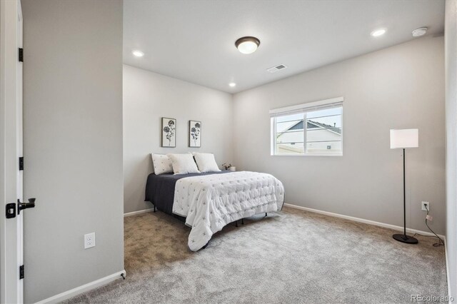 5142 N Quemoy Ct, Aurora, CO 80019 - bedroom with carpet, baseboards, and recessed lighting