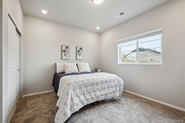 5142 N Quemoy Ct, Aurora, CO 80019 - bedroom with carpet, baseboards, a closet, and recessed lighting