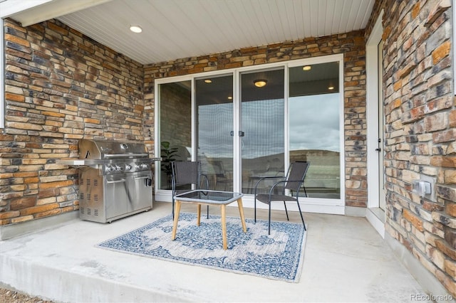 5142 N Quemoy Ct, Aurora, CO 80019 - view of patio with a grill