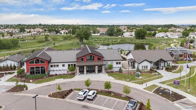 5142 N Quemoy Ct, Aurora, CO 80019 - aerial perspective of suburban area with a nearby body of water