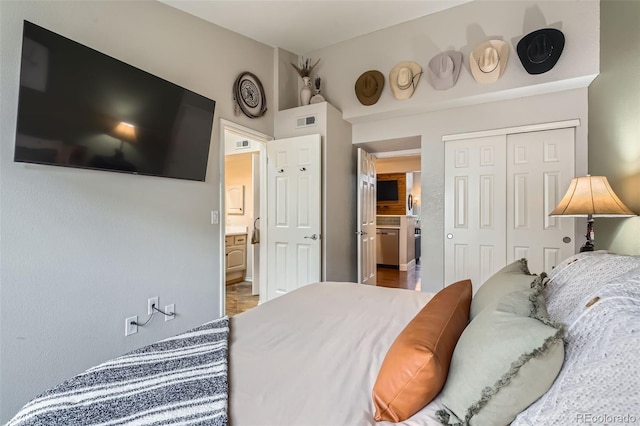 bedroom featuring visible vents and a closet