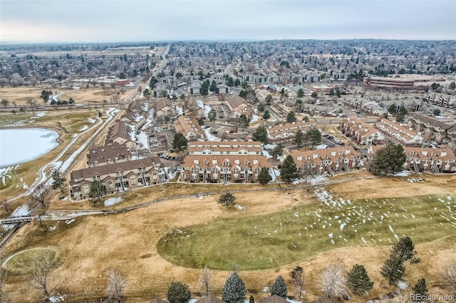 drone / aerial view with a water view and a residential view