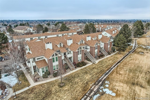 birds eye view of property with a residential view