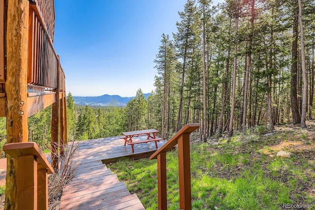 11876 Coal Creek Heights Dr, Golden, CO 80403 - wooden terrace featuring a mountain view and a wooded view
