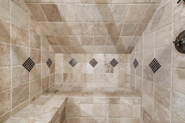 full bath featuring a tile shower