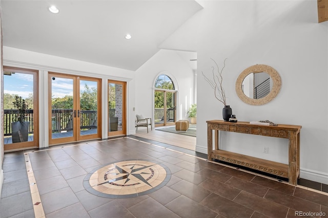 tiled foyer entrance with baseboards, high vaulted ceiling, french doors, and recessed lighting