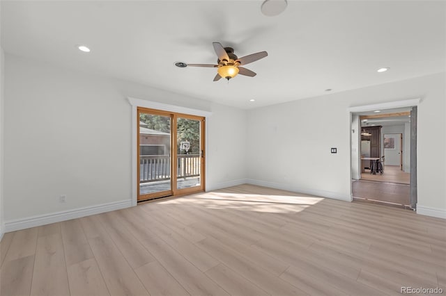 spare room featuring light wood-style flooring, baseboards, a ceiling fan, and recessed lighting