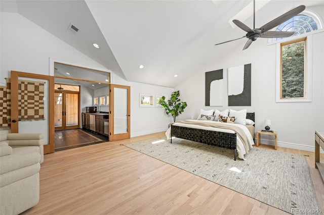 bedroom featuring a sink, wood finished floors, and visible vents