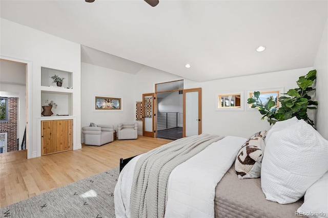 bedroom featuring a ceiling fan, vaulted ceiling, wood finished floors, and recessed lighting