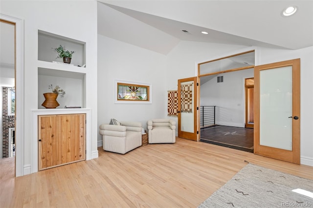 unfurnished room featuring recessed lighting, visible vents, wood finished floors, and french doors