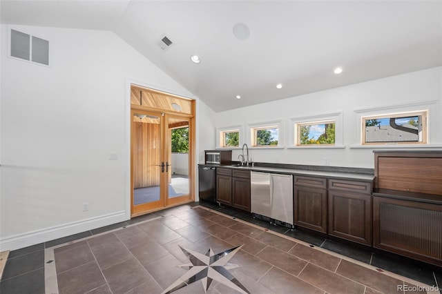 kitchen with dark countertops, visible vents, and dishwasher