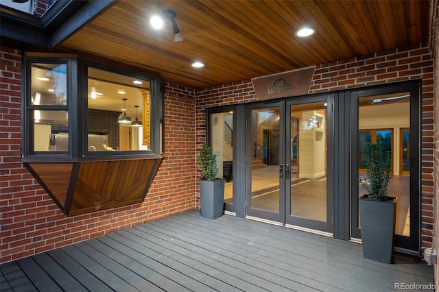 wooden deck featuring french doors