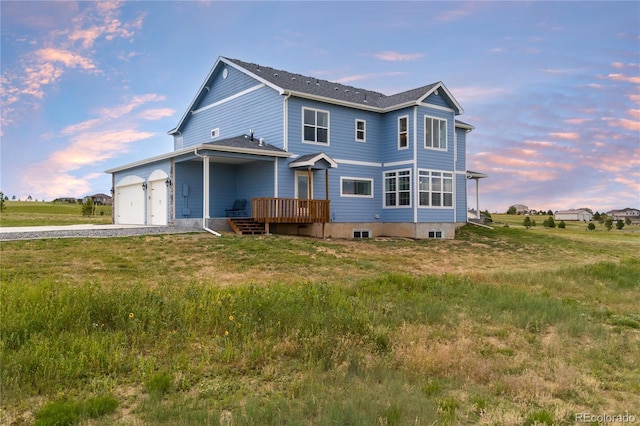 2490 Sagebrush St, Parker, CO 80138 - view of front of property with driveway, a deck, an attached garage, and a yard