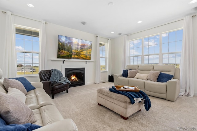 2490 Sagebrush St, Parker, CO 80138 - living room featuring carpet, a warm lit fireplace, and recessed lighting